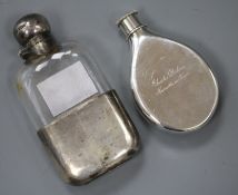 A late Victorian silver hip flask and a silver mounted glass hip flask.