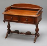 A 19th century apprentice piece two drawer miniature mahogany writing table