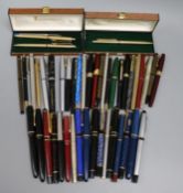 A collection of fountain and ball point pens