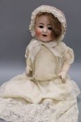 An A & B bisque headed doll, open mouthed with sleeping eyes, jointed body, impressed mark 1352 over