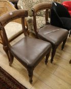 A pair of early Victorian mahogany leather upholstered dining chairs