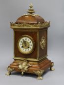 A French oak brass mounted mantel clock