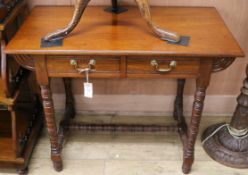 An Edwardian mahogany writing table W.92cm