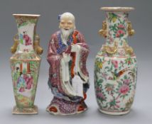 Two Chinese famille roses vases and a porcelain figure of an immortal tallest 25.5cm