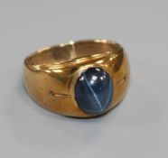 A 10k gold and cabochon blue star sapphire ring, size Q.