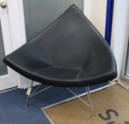 A black leather and chrome 'coconut' chair W.110cm