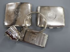 Two silver cigarette cases, a silver card case, a silver egg cup and a silver bracelet.
