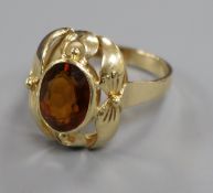 A 585 yellow metal and oval citrine dress ring, size N.