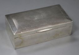 An engine turned silver cigarette box, 16.5cm.