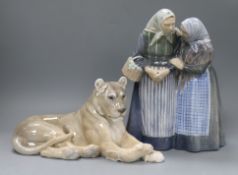A Royal Copenhagen porcelain lion (804) and a figure group of talking ladies (1319) tallest 29cm