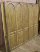 Five 19th century arched oak simulated pine panelling sections Approx. 22ft.