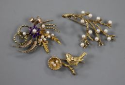 Three assorted 9ct gold and gem set brooches including bird with bird's nest.