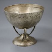 A stylish Edwardian Art Nouveau Scottish planished silver bowl on tripod supports, Hamilton &