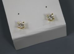 A pair of bright-cut diamond stud earrings, yellow metal settings, approx 0.33ct each diamond.