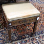 An Edwardian mahogany piano stool with leather seat W.50cm