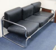 A steel tube frame and black leather sofa W.183cm