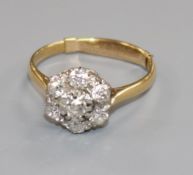 An 18ct gold, platinum and diamond cluster ring, size Q.