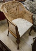 A 1920's caned mahogany tub framed chair.