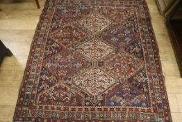 A North West Persian red and blue ground rug 190 x 150cm