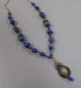A gilt metal and coloured glass necklace, approx. 50cm.