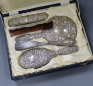 A case with silver mirror, comb, brushes etc.