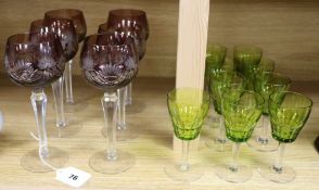 A set of six amethyst hock glasses and nine smaller green glasses hock glass height 21cm