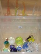 A collection of paperweights and Venetian glass snakes