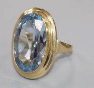 A 9k gold and synthetic blue spinel dress ring, size I.