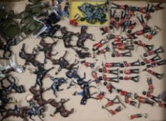 A collection of English and Scottish lead soldiers, guns etc