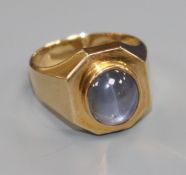 A 14k gold and cabochon star sapphire octagonal ring, size Q.