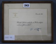 An Adolf Hitler Christmas and New Year card in frame