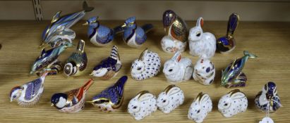 Twenty one Royal Crown Derby paperweights, modelled as dolphins, birds, rabbits and a duck