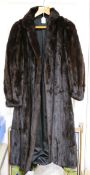 A brown full length mink coat