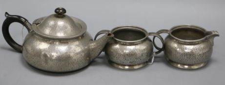 A Liberty Tudric pewter three piece teaset