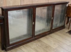 A 19th century mahogany shop display cabinet W.205cm