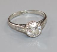 A mid 20th century platinum and single stone diamond ring with diamond set shoulders, the round