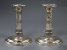A pair of late Victorian silver candlesticks, George Howson, Sheffield, 1900, 16cm.