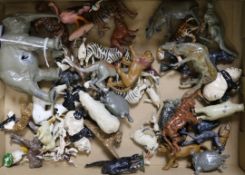 A collection of lead zoo animals, fencing, trees and kiosks