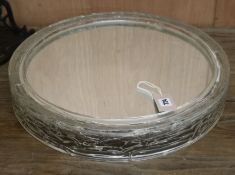 A 1970's circular perspex mirror W.48.5cm