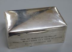 A George V silver cigarette box, 14cm.