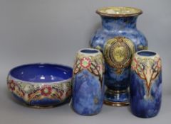 A Royal Doulton vase decorated with profile portrait plaques and urns and a pair of ovoid vases