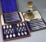 A 1920's silver bell shaped ink stand and three cased sets of flatware including silver teaspoons.