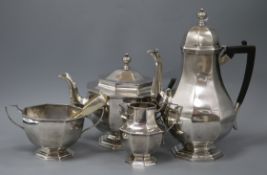 An Edwardian 18th century style four piece silver tea and coffee service by Thomas Bradbury &
