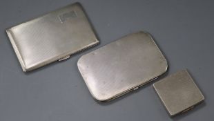 Two engine tuned silver cigarette cases including one by Asprey & Co and a silver compact.