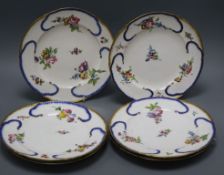 A set of six Sevres plates, painted in colours, with bouquets of flowers, surrounded by blue scrolls