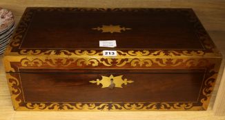 A Regency rosewood and brass inlaid rectangular writing box, with lifting top enclosing a fitted