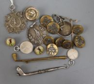 Nineteen assorted golf related items including silver medallions, Edwardian silver golf club