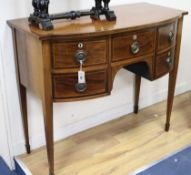 A small Regency rosewood banded mahogany bowfront sideboard 107cm