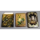 Three Victorian japanned papier mache card cases,