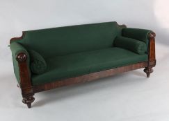 A William IV mahogany framed settee, with rectangular back and circular foliate boss arm finials,